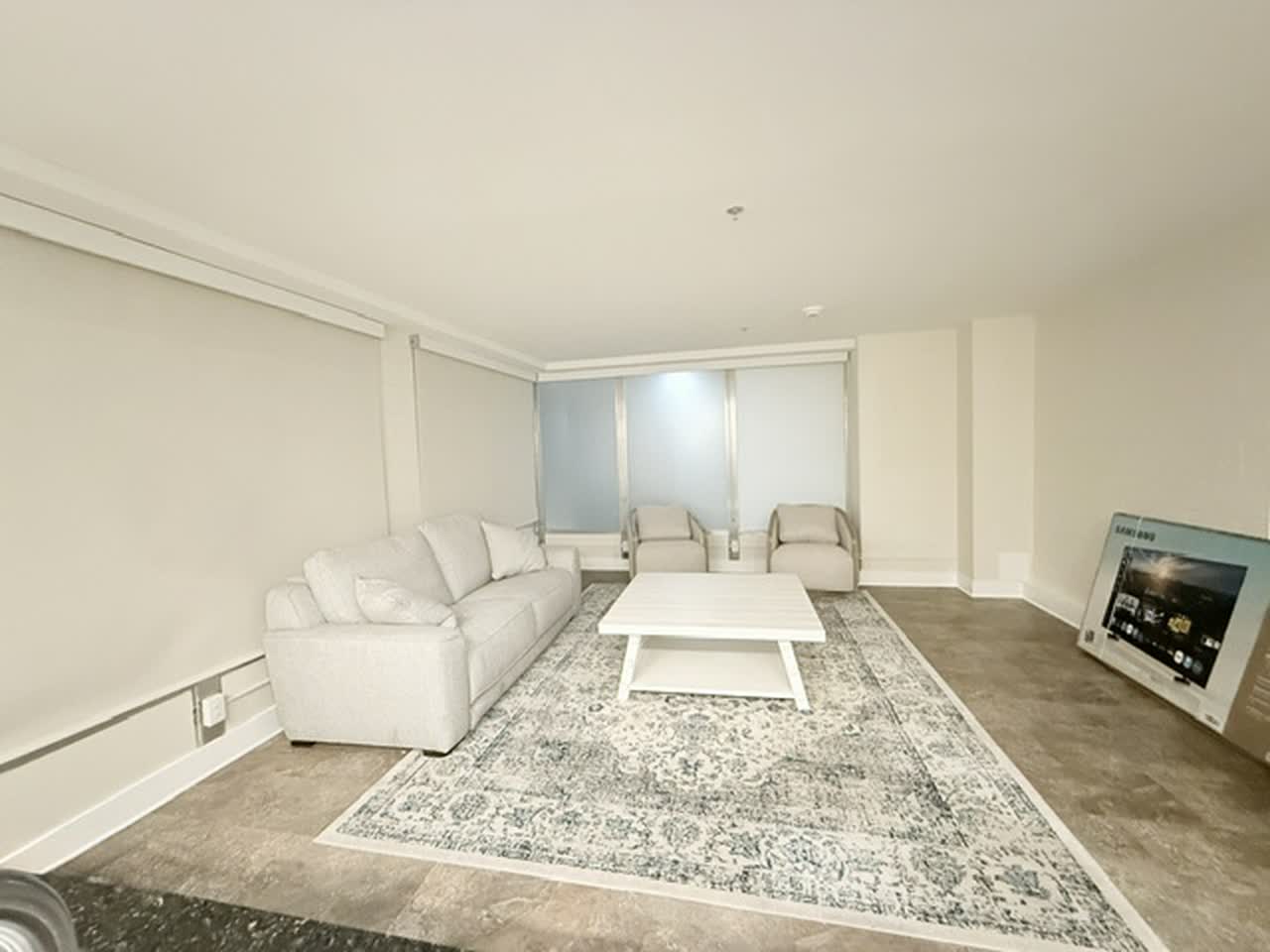 Furnished living room with sectional sofa and armchairs